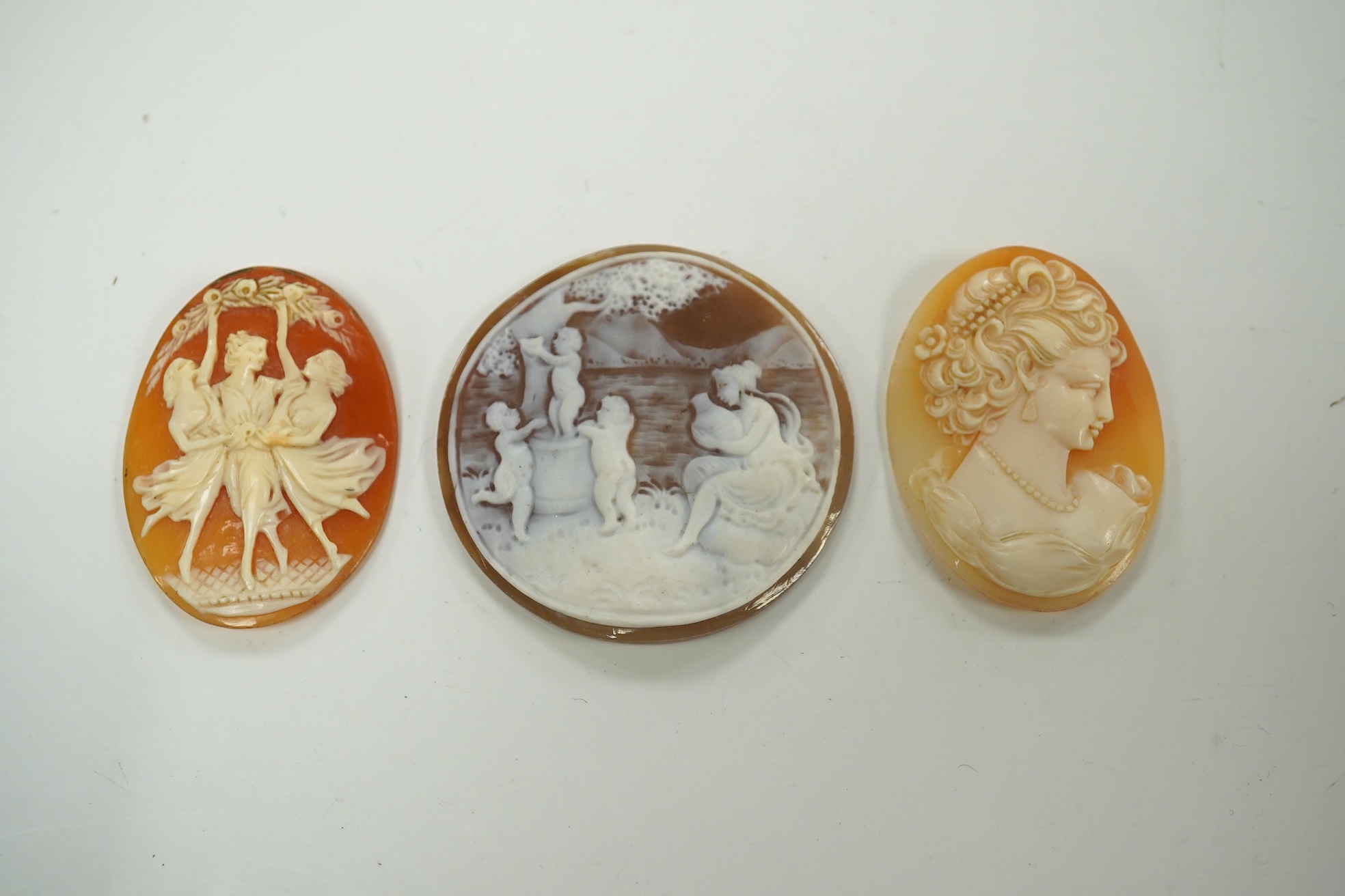 A quantity of assorted unmounted mainly carved cameo shells, largest 55mm. Condition - poor to fair to good